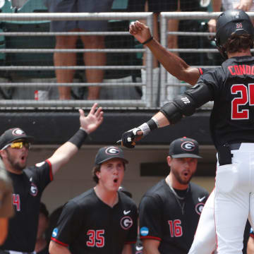 Georgia's Charlie Condon (24) celebrates with his teammate after hitting a home run during a NCAA Athens Regional baseball game against Army in Athens, Ga., on Friday, May 31, 2024.