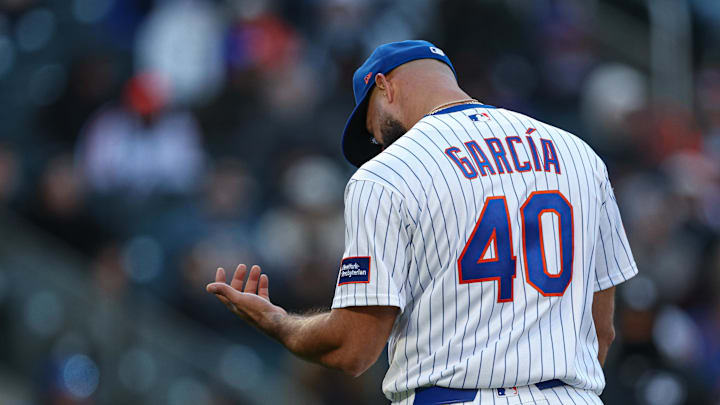 Apr 7, 2026; New York City, New York, USA; New York Mets pitcher Luis Garcia (40) reacts after being hit by a ground ball during the seventh inning against the Arizona Diamondbacks  at Citi Field. Mandatory Credit: Vincent Carchietta-Imagn Images