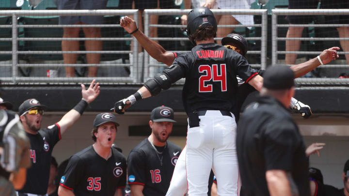 Georgia's Charlie Condon (24) celebrates with his teammate after hitting a home run during a NCAA Athens Regional baseball game against Army in Athens, Ga., on Friday, May 31, 2024.