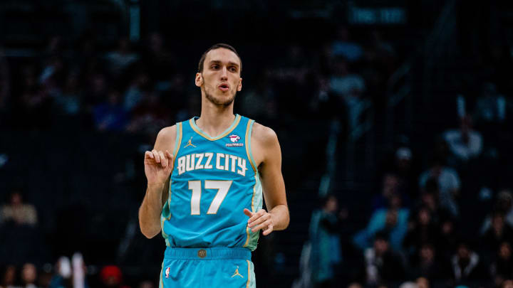 Apr 7, 2024; Charlotte, North Carolina, USA; Charlotte Hornets forward Aleksej Pokusevski (17) celebrates after scoring against the Oklahoma City Thunder at Spectrum Center. Mandatory Credit: Scott Kinser-USA TODAY Sports