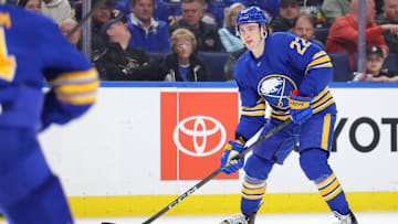 Mar 27, 2025; Buffalo, New York, USA;  Buffalo Sabres right wing Jack Quinn (22) looks to make a pass during the second period against the Pittsburgh Penguins at KeyBank Center. Mandatory Credit: Timothy T. Ludwig-Imagn Images