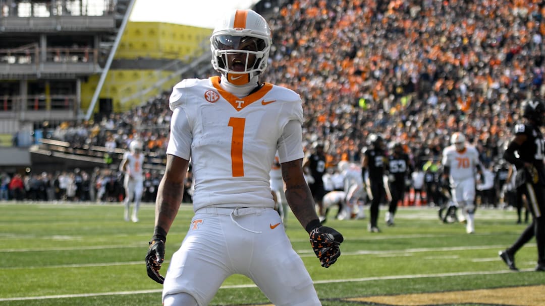 Nov 30, 2024; Nashville, Tennessee, USA;  Tennessee Volunteers wide receiver Dont'e Thornton Jr. (1) celebrates his touchdown with his teammates against the Vanderbilt Commodores during the first half at FirstBank Stadium. Mandatory Credit: Steve Roberts-Imagn Images