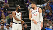 Apr 11, 2025; Sacramento, California, USA; Los Angeles Clippers guard James Harden (1) and center Ivica Zubac (40) talk during the third quarter against the Sacramento Kings at Golden 1 Center. Mandatory Credit: Darren Yamashita-Imagn Images