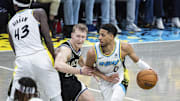 Apr 19, 2025; Indianapolis, Indiana, USA; Indiana Pacers guard Tyrese Haliburton (0) dribbles the ball while Milwaukee Bucks guard AJ Green (20) defends in the second half at Gainbridge Fieldhouse. Mandatory Credit: Trevor Ruszkowski-Imagn Images