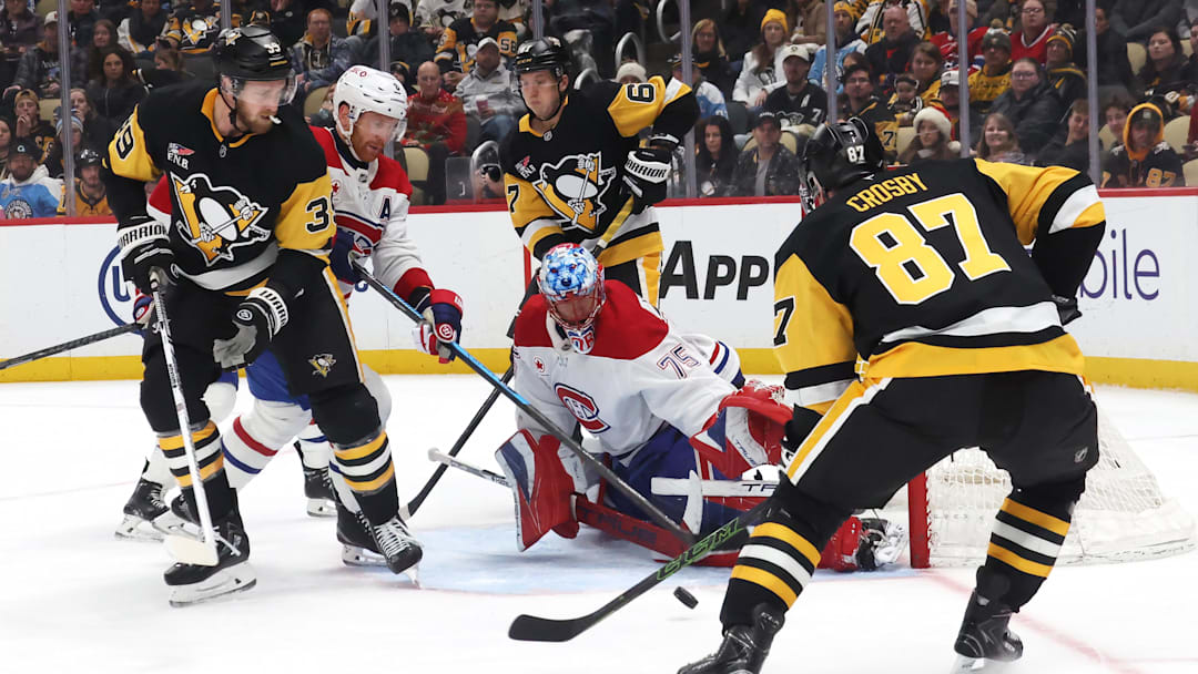 Dec 21, 2025; Pittsburgh, Pennsylvania, USA;  Montréal Canadiens goaltender Jakub Dobes (75) makes a save against Pittsburgh Penguins center Sidney Crosby (87) during the third period at PPG Paints Arena. Mandatory Credit: Charles LeClaire-Imagn Images