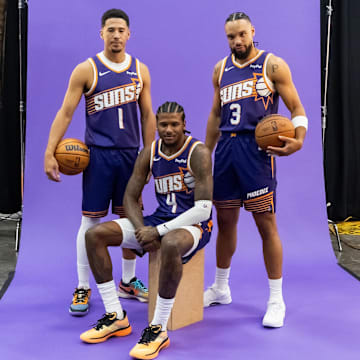 Sep 24, 2025; Phoenix, AZ, USA; Phoenix Suns guard Devin Booker (1), forward Dillon Brooks (3) and guard Jalen Green (4) pose for portrait during Media Day at PHX Arena. Mandatory Credit: Mark J. Rebilas-Imagn Images