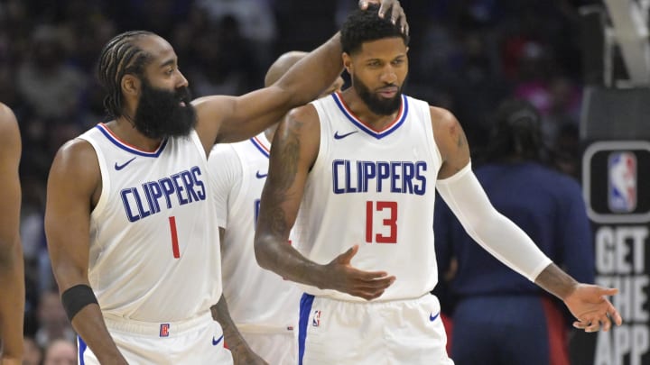 Apr 4, 2024; Los Angeles, California, USA; Los Angeles Clippers forward Paul George (13) gets a pat from guard James Harden (1) in the second half against the Denver Nuggets at Crypto.com Arena. Mandatory Credit: Jayne Kamin-Oncea-USA TODAY Sports