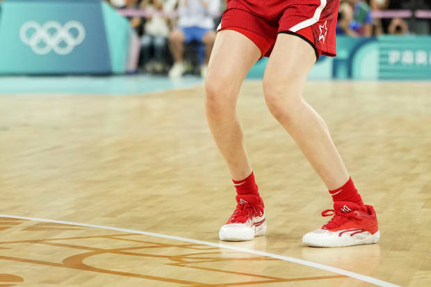 USA forward Breanna Stewart's red and white PUMA sneakers.