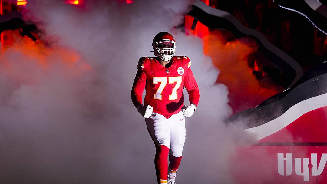 Oct 27, 2025; Kansas City, Missouri, USA; Kansas City Chiefs guard Jaylon Moore (77) takes the field prior to a game against the Washington Commanders at GEHA Field at Arrowhead Stadium. Mandatory Credit: Jay Biggerstaff-Imagn Images