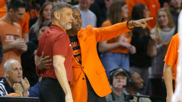 Oklahoma Sooners head coach Porter Moser and Oklahoma State Cowboys head coach Mike Boynton talk before a men's Bedlam college basketball game between the Oklahoma State University Cowboys (OSU) and the University of Oklahoma Sooners (OU) at Gallagher-Iba Arena in Stillwater, Okla., Wednesday, Jan. 18, 2023.