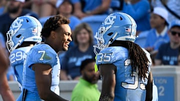 Sep 13, 2025; Chapel Hill, North Carolina, USA; North Carolina Tar Heels running back Demon June (35) celebrates with linebacker Khmori House (7) after scoring a touchdown in the fourth quarter at Kenan Stadium. Mandatory Credit: Bob Donnan-Imagn Images