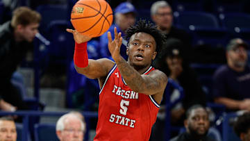 Feb 10, 2024; Colorado Springs, Colorado, USA; Fresno State Bulldogs guard Jalen Weaver (5) controls the ball in the second half against the Air Force Falcons at Clune Arena. Mandatory Credit: Isaiah J. Downing-Imagn Images