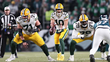 Jan 12, 2025; Philadelphia, Pennsylvania, USA; Green Bay Packers quarterback Jordan Love (10) and center Josh Myers (71) in action against the Philadelphia Eagles in an NFC wild card game at Lincoln Financial Field. Mandatory Credit: Bill Streicher-Imagn Images