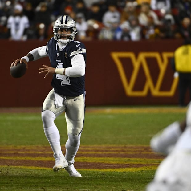 Dallas Cowboys quarterback Dak Prescott looks to pass against the Washington Commanders.