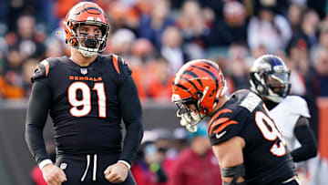 Cincinnati Bengals defensive end Trey Hendrickson, left, and Cincinnati Bengals defensive end Sam Hubbard celebrate a sack in the second quarter during a Week 16 NFL game against the Baltimore Ravens. 