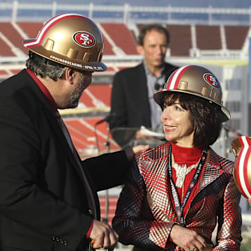 April 19, 2012; Santa Clara, CA, USA; Santa Clara mayor Jamie Matthew speaks with San Francisco 49ers co-chairman Denise DeBartolo York and chief executive officer Jed York during the groundbreaking ceremony at the site of the new 49ers Stadium. Mandatory Credit: Kelley L Cox-Imagn Images