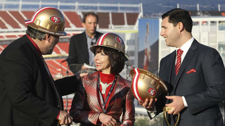 April 19, 2012; Santa Clara, CA, USA; Santa Clara mayor Jamie Matthew speaks with San Francisco 49ers co-chairman Denise DeBartolo York and chief executive officer Jed York during the groundbreaking ceremony at the site of the new 49ers Stadium. Mandatory Credit: Kelley L Cox-Imagn Images