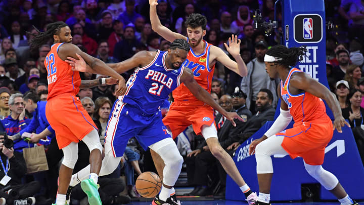 Apr 2, 2024; Philadelphia, Pennsylvania, USA; Philadelphia 76ers center Joel Embiid (21) battles for