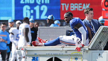 Sep 28, 2025; East Rutherford, New Jersey, USA; New York Giants wide receiver Malik Nabers (1) is carted off the field following an injury during the second quarter against the Los Angeles Chargers at MetLife Stadium. Mandatory Credit: Brad Penner-Imagn Images