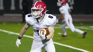 Brophy running back looks for an opening against Hamilton during a game at Hamilton High School in Chandler, on Sept. 19, 2025.