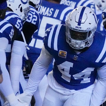 Indianapolis Colts linebacker Zaire Franklin (44) high fives his teammates as he takes the field Sunday, Oct. 20, 2024, during a game against the Miami Dolphins at Lucas Oil Stadium in Indianapolis.