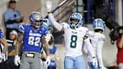 Oct 13, 2023; Memphis, Tennessee, USA; Tulane Green Wave defensive back Kam Pedescleaux (8) waves to fans during the second half against the Memphis Tigers at Simmons Bank Liberty Stadium. Mandatory Credit: Petre Thomas-Imagn Images