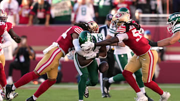 Sep 9, 2024; Santa Clara, California, USA; San Francisco 49ers linebacker Fred Warner (left) forces a fumble with linebacker De'Vondre Campbell (right) against New York Jets running back Breece Hall (20) during the first quarter at Levi's Stadium. Mandatory Credit: Darren Yamashita-Imagn Images
