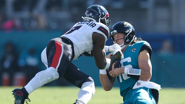 Dec 1, 2024; Jacksonville, Florida, USA; Texans’ Azeez Al-Shaair gives Jaguars’ Trevor Lawrence a concussion.