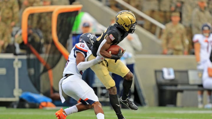 Nov 13, 2021; West Point, New York, USA; Army Black Knights wide receiver Isaiah Alston (86) runs after making a catch in front of Bucknell Bisons cornerback Ethan Robinson (26) during the first half at Michie Stadium. Mandatory Credit: Danny Wild-USA TODAY Sports