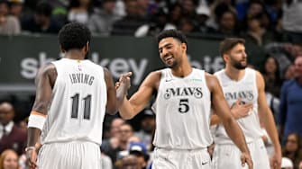 Nov 27, 2024; Dallas, Texas, USA; Dallas Mavericks guard Spencer Dinwiddie (26) and guard Kyrie Irving (11) and guard Quentin Grimes (5) during the game between the Dallas Mavericks and the New York Knicks at the American Airlines Center. Mandatory Credit: Jerome Miron-Imagn Images