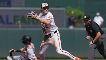 Sep 19, 2024; Baltimore, Maryland, USA; Baltimore Orioles shortstop Gunnar Henderson (2) forces out San Francisco Giants shortstop Tyler Fitzgerald (49) to start a second inning double play at Oriole Park at Camden Yards. Mandatory Credit: Mitch Stringer-Imagn Images