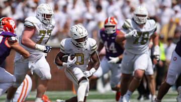 Sep 13, 2025; Atlanta, Georgia, USA; Georgia Tech Yellow Jackets running back Malachi Hosley (0) runs the ball against the Clemson Tigers in the second quarter at Bobby Dodd Stadium at Hyundai Field. Mandatory Credit: Brett Davis-Imagn Images