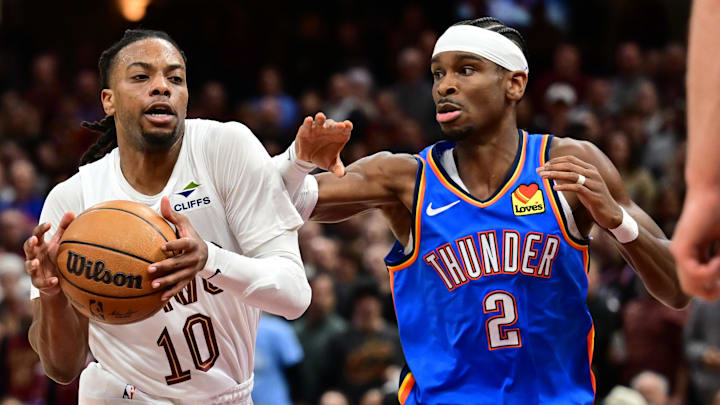 Darius Garland drives on Shai Gilgeous-Alexander during the Cavaliers' 129–122 win over the Thunder on Jan. 8, 2025. Darius Garland drives on Shai Gilgeous-Alexander during the Cavaliers' 129–122 win over the Thunder on Jan. 8, 2025.