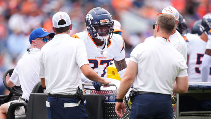 Aug 25, 2024; Denver, Colorado, USA; Denver Broncos cornerback Damarri Mathis (27) leaves the field after an injury in the first quarter against the Arizona Cardinals at Empower Field at Mile High. 