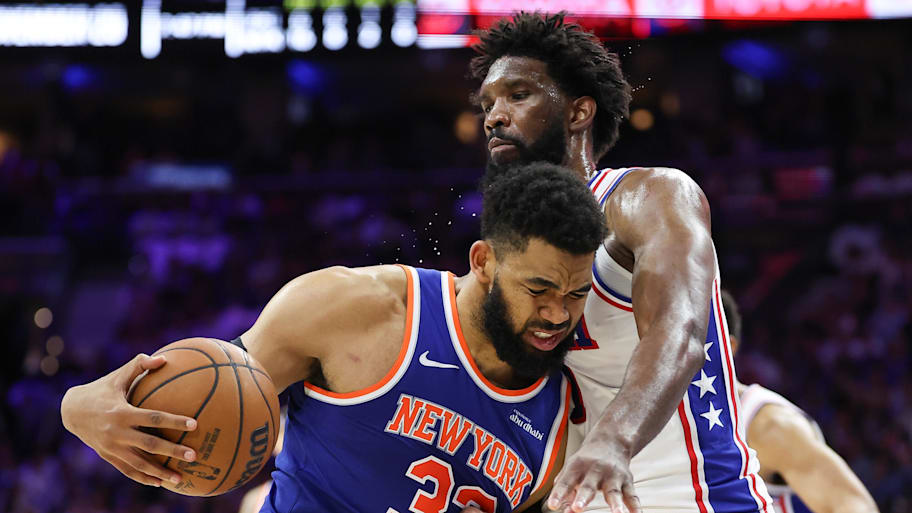 Knicks center Karl-Anthony Towns drives against 76ers center Joel Embiid.