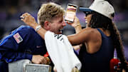 Hunter Woodhall and Tara Davis-Woodhall celebrated an epic win after Hunter won gold in the Paralympics 400 meter sprint.