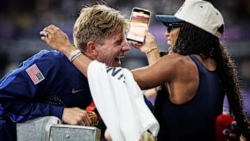 Hunter Woodhall and Tara Davis-Woodhall celebrated an epic win after Hunter won gold in the Paralympics 400 meter sprint.