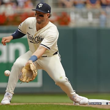 Aug 14, 2024; Minneapolis, Minnesota, USA; Kansas City Royals pinch runner Maikel Garcia (11) steals second base against Minnesota Twins second baseman Kyle Farmer (12) in the seventh inning at Target Field. Mandatory Credit: Bruce Kluckhohn-Imagn Images