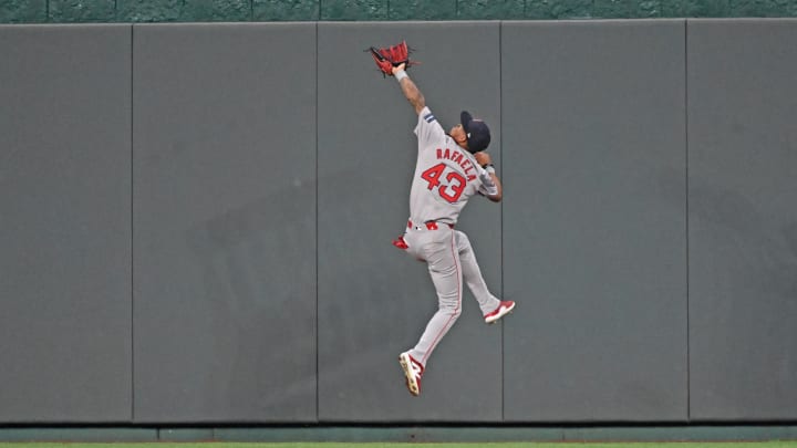 Aug 5, 2024; Kansas City, Missouri, USA;  Boston Red Sox center fielder Ceddanne Rafaela (43) catches a fly ball in front of the center field wall against Kansas City Royals Maikel Garcia (not pictured) in the fifth inning at Kauffman Stadium. Mandatory Credit: Peter Aiken-USA TODAY Sports