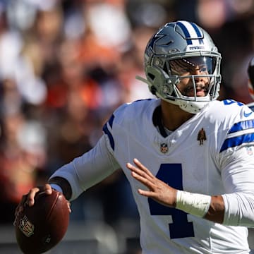 Dallas Cowboys quarterback Dak Prescott (4) looks for an available receiver during the first quarter against the Cleveland Browns at Huntington Bank Field.