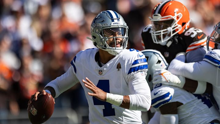 Dallas Cowboys quarterback Dak Prescott (4) looks for an available receiver during the first quarter against the Cleveland Browns at Huntington Bank Field.