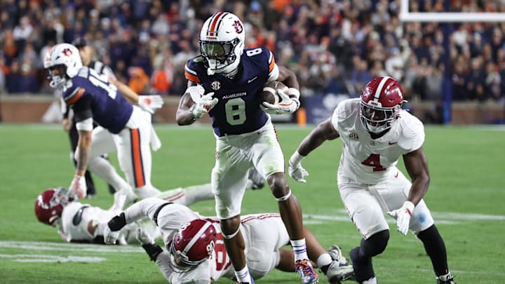 Nov 29, 2025; Auburn, Alabama, USA; Auburn Tigers wide receiver Cam Coleman (8) carries the ball during the second half against the Alabama Crimson Tide at Jordan-Hare Stadium. Mandatory Credit: John Reed-Imagn Images