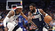 May 28, 2024; Dallas, Texas, USA; Dallas Mavericks guard Kyrie Irving (11) dribbles as Minnesota Timberwolves forward Jaden McDaniels (3) defends during the fourth quarter of game four of the western conference finals for the 2024 NBA playoffs at American Airlines Center. Mandatory Credit: Kevin Jairaj-Imagn Images