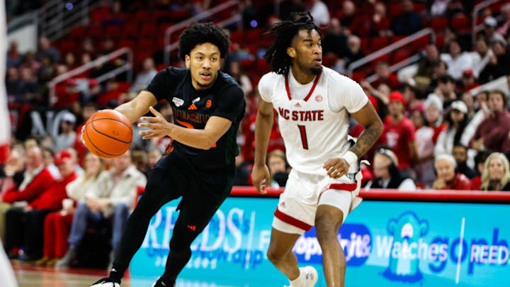 Jan 30, 2024; Raleigh, North Carolina, USA; Miami (Fl) Hurricanes guard Nijel Pack (24) dribbles with the ball during the second half against North Carolina State Wolfpack at PNC Arena. Mandatory Credit: Jaylynn Nash-Imagn Images
