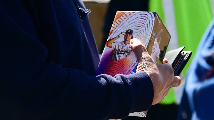 Apr 2, 2025; Los Angeles, California, USA; Spectators receive Shohei Ohtani bobblehead before the Los Angeles Dodgers play against the Atlanta Braves at Dodger Stadium. Mandatory Credit: Gary A. Vasquez-Imagn Images