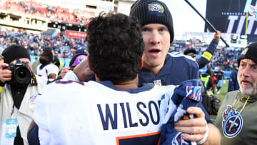 Nov 13, 2022; Nashville, Tennessee, USA; Denver Broncos quarterback Russell Wilson (3) and Tennessee Titans quarterback Ryan Tannehill exchange words after a game. 