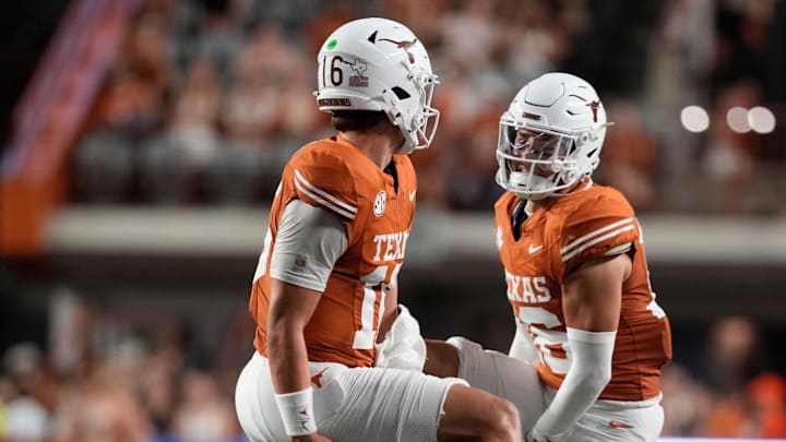 Sep 20, 2025; Austin, Texas, USA; Texas Longhorns quarterback Arch Manning (16) and defensive back Michael Taaffe (16) celebrate after Manning ran for a touchdown during the first half against the Sam Houston Bearkats at Darrell K Royal-Texas Memorial Stadium. Mandatory Credit: Scott Wachter-Imagn Images