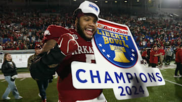 Dec 27, 2024; Memphis, TN, USA; Arkansas Razorbacks defensive linemen Cameron Ball (5) reacts after defeating the Texas Tech Red Raiders at Simmons Bank Liberty Stadium. Mandatory Credit: Petre Thomas-Imagn Images