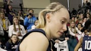 UConn guard Paige Bueckers signs autographs after their game at the Al McGuire Center in Milwaukee, Wisconsin.