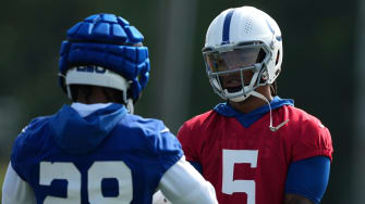 Indianapolis Colts quarterback Anthony Richardson (5) goes to high five running back Jonathan Taylor (28) during the first day of the Indianapolis Colts’ training camp Thursday, July 25, 2024, at Grand Park Sports Complex in Westfield.